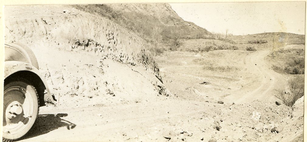 Steep Clay Buttes and Ledges of Sand Stone Rock on Trail