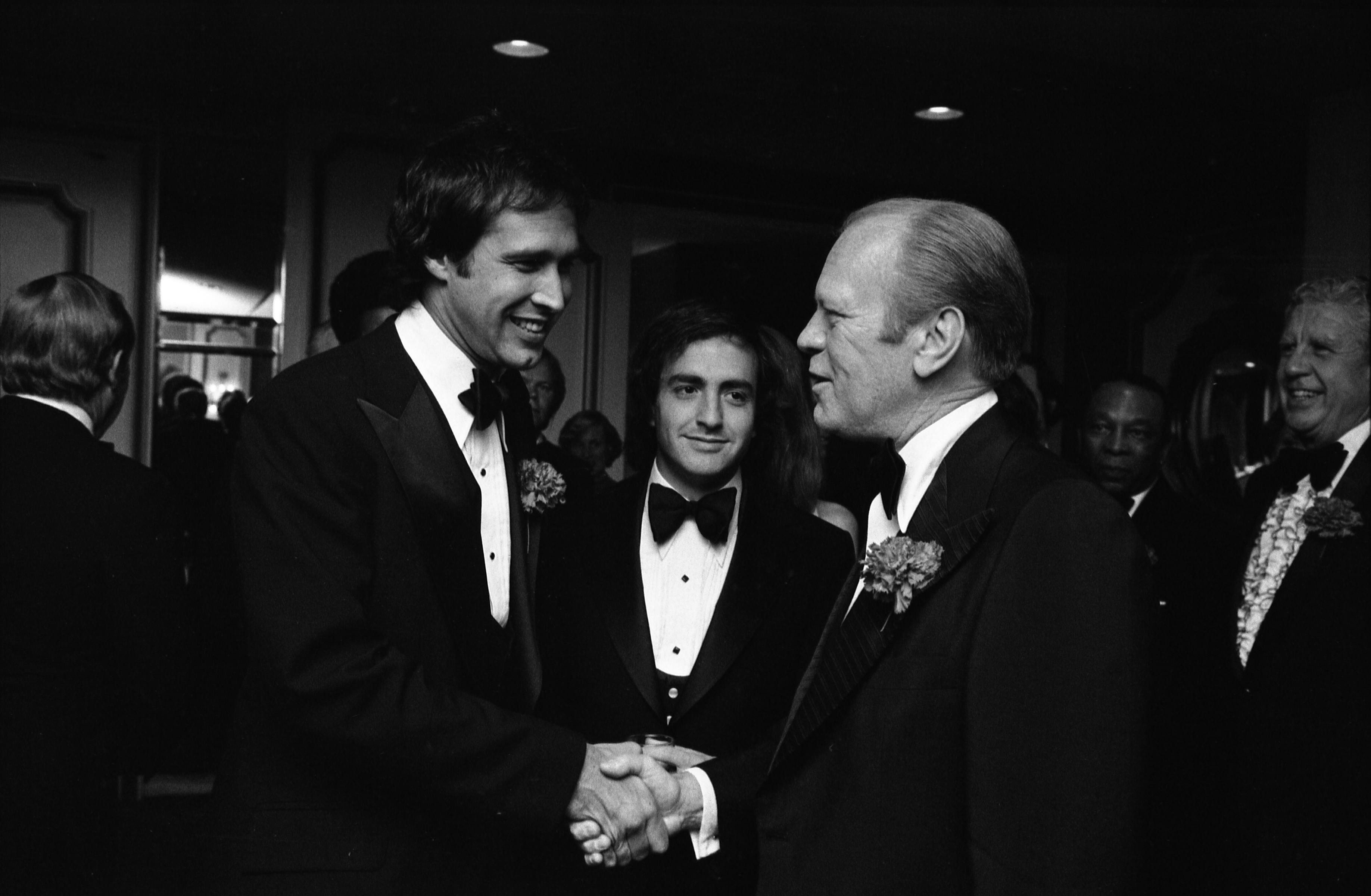 Chevy Chase, Saturday Night Live Producer Lorne Michaels, and President Gerald R. Ford at the 32nd Annual Radio and Television Correspondents Association Dinner