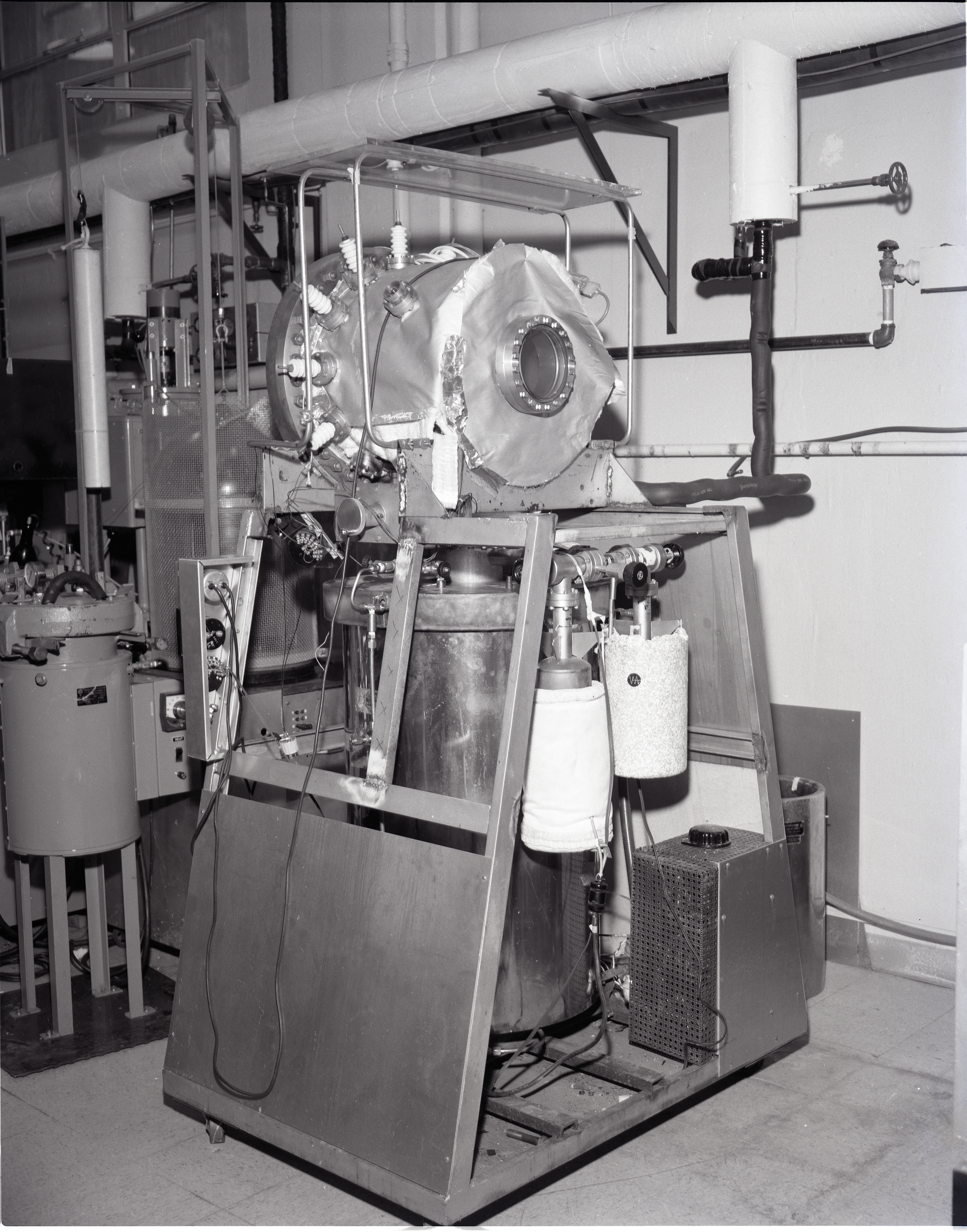 TEST RIGS - PARYLENE RIG - X FORMER LIFE TEST - LAMINATE LIFE TEST - PRESSURE POTS - TALL BELL JAR AND LOW - COMMUNICATION TECHNOLOGY SATELLITE CTS OUT GASSING