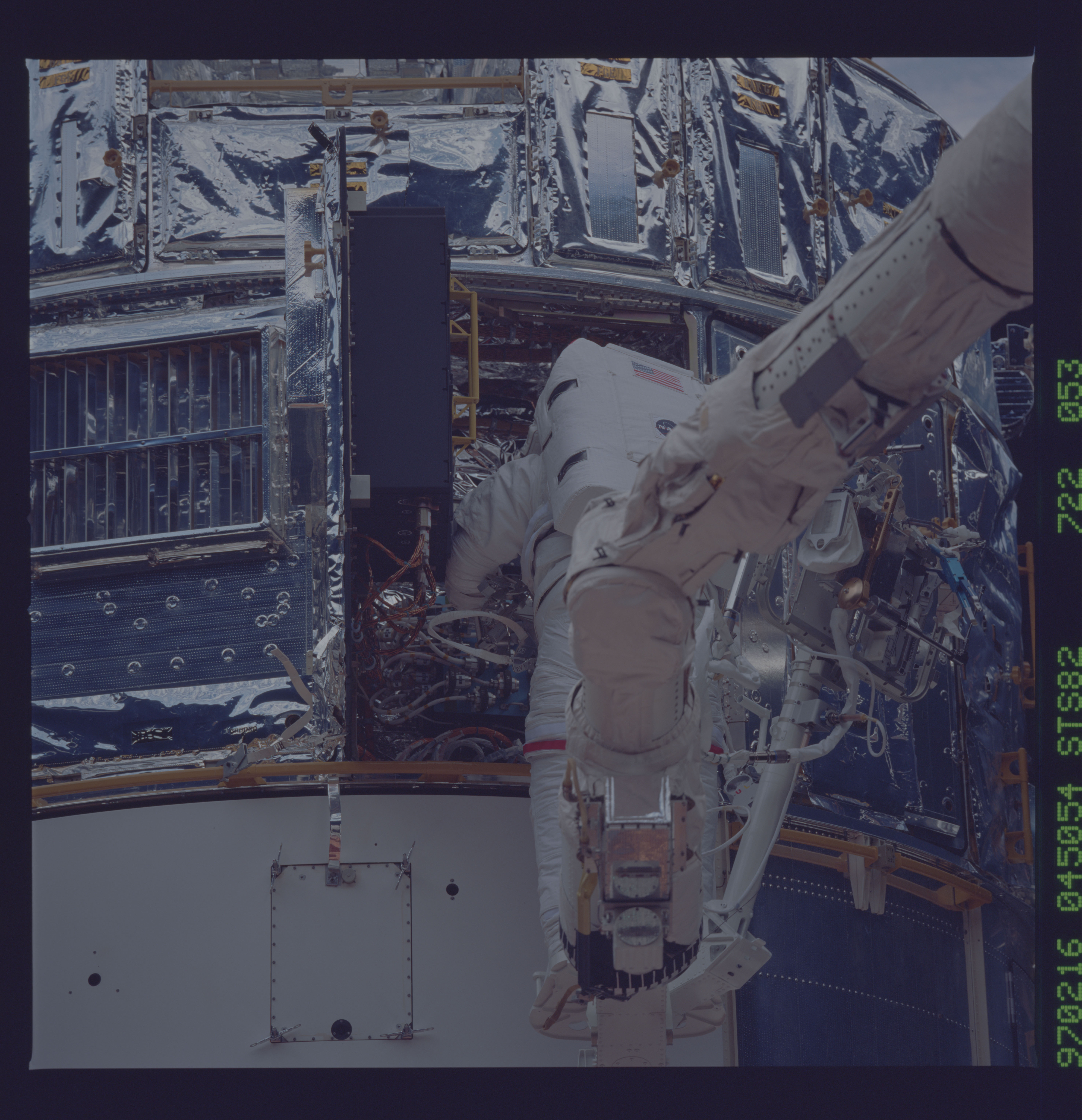 STS082-722-053 - STS-082 - EVA 3 on Flight Day 6 to service the Hubble Space Telescope
