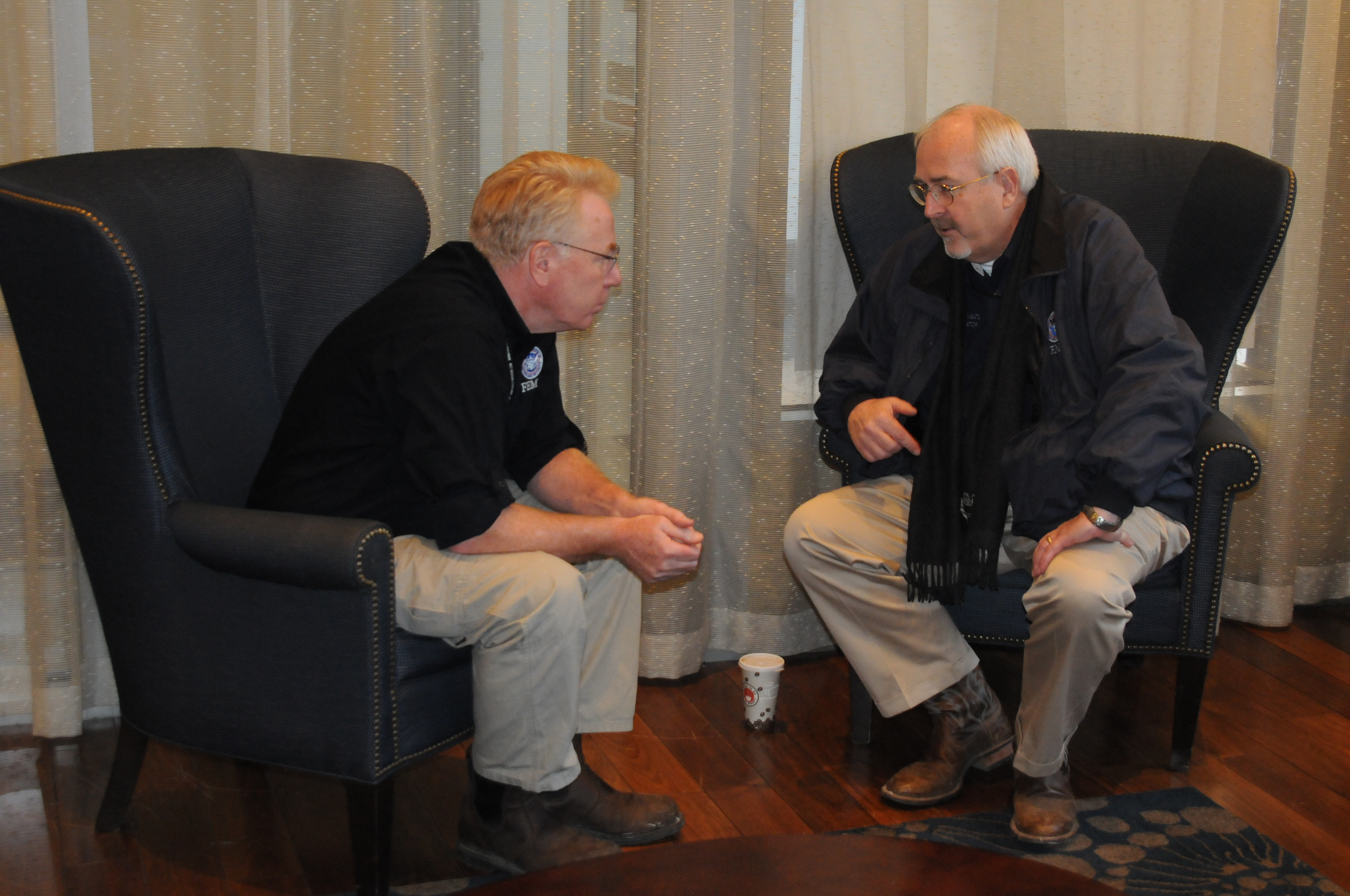 Brooklyn, N.Y., Nov. 9, 2012 -- FEMA Administrator Craig Fugate confers with Federal Coordinating Officer Michael Byrne speak at the FEMA Initial Operating Facility. FEMA staff from across the country are gathering here to help the survivors of Hurricane Sandy recover. George Armstrong/FEMA