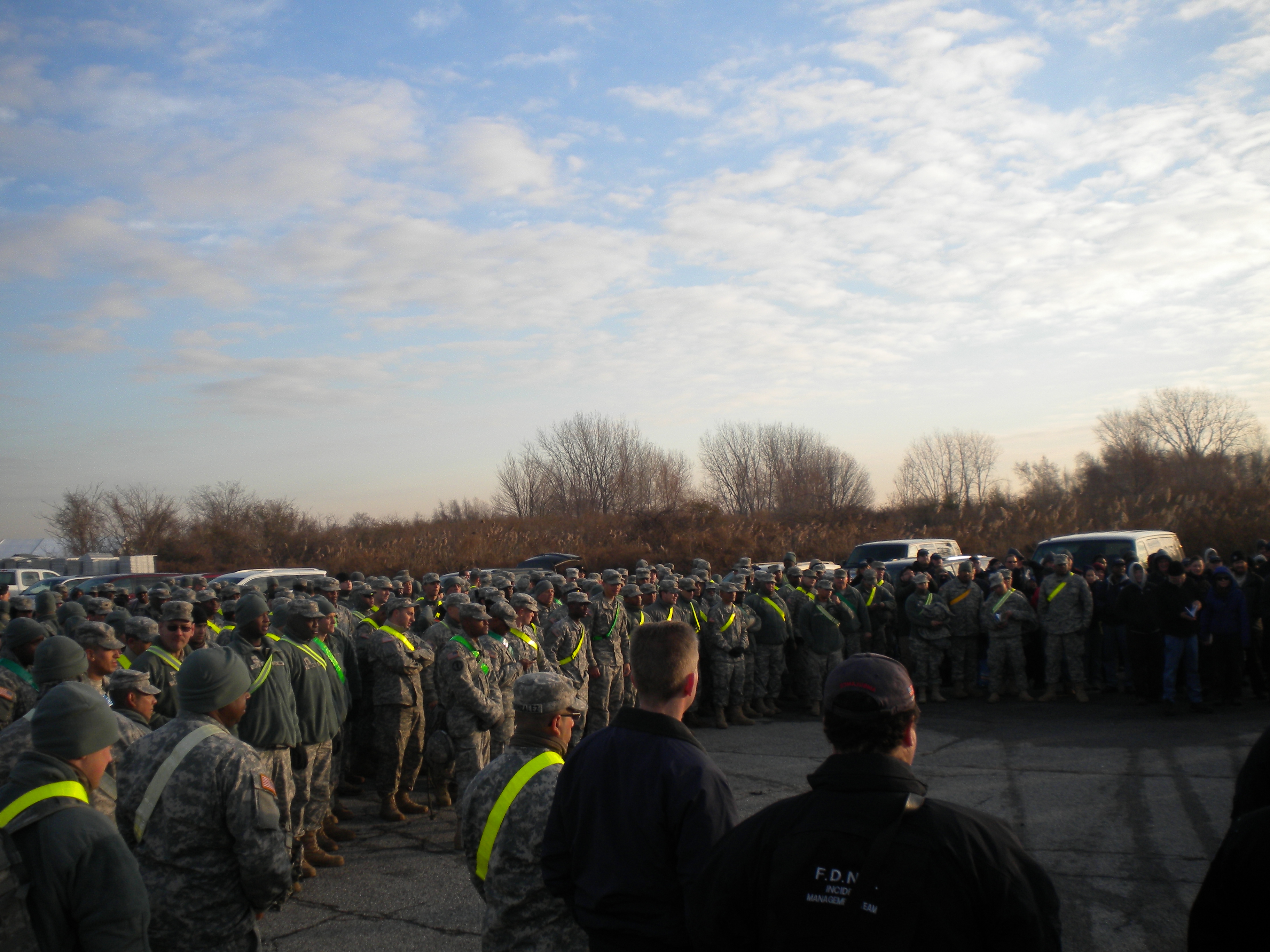 Rockaway, N.Y., Nov. 28, 2012 ΓÇô FEMA's Community Relations Teams, FEMA Corps, and the Fire Department of New York City, gather at the Floyd Bennett Field in Brooklyn to help support The National Guard in the health and wellness checks operation at Floyd Bennett Field. Photo by Geralda Calixte